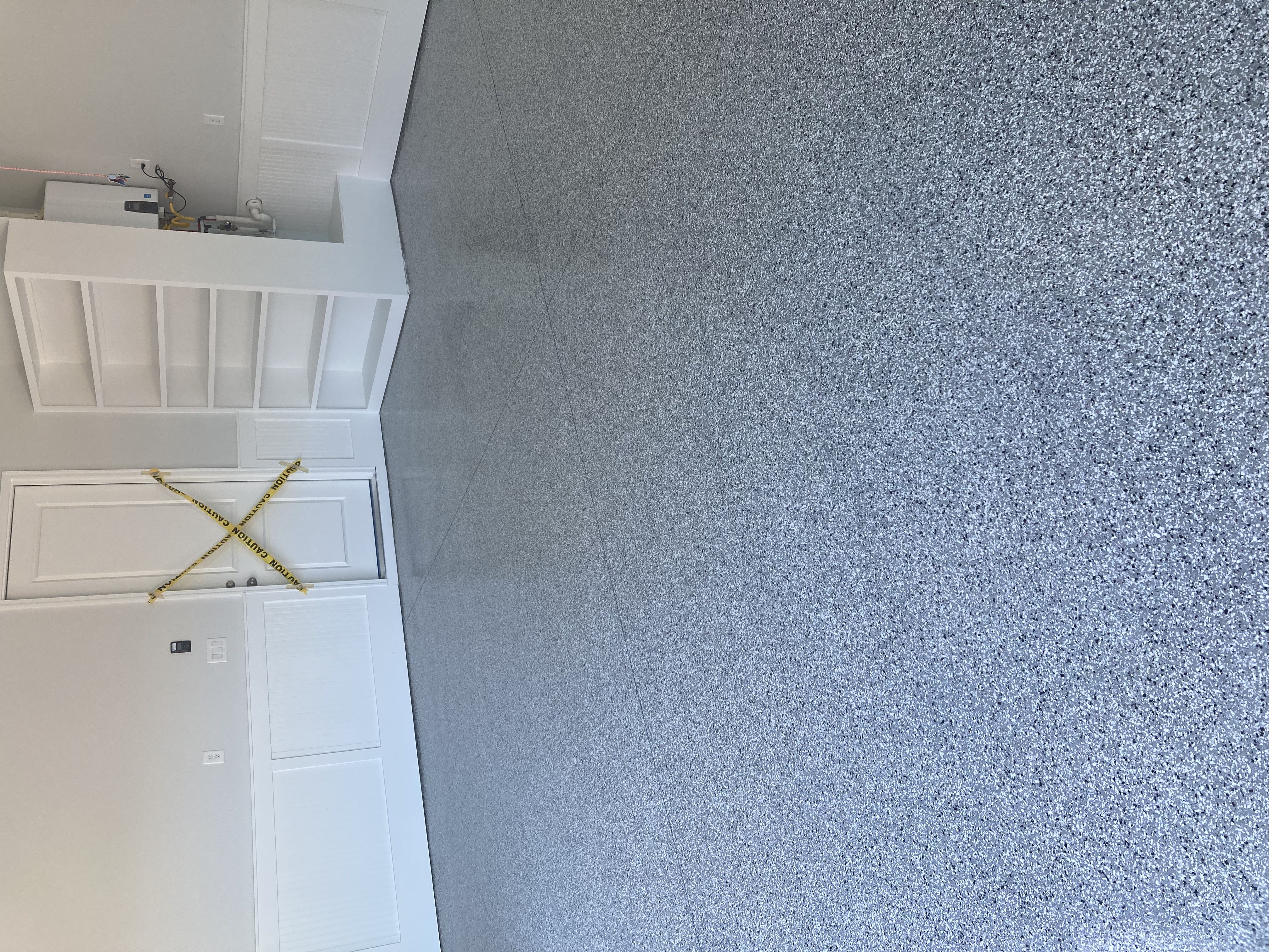 Epoxy garage floor grey flake car lift residential workshop