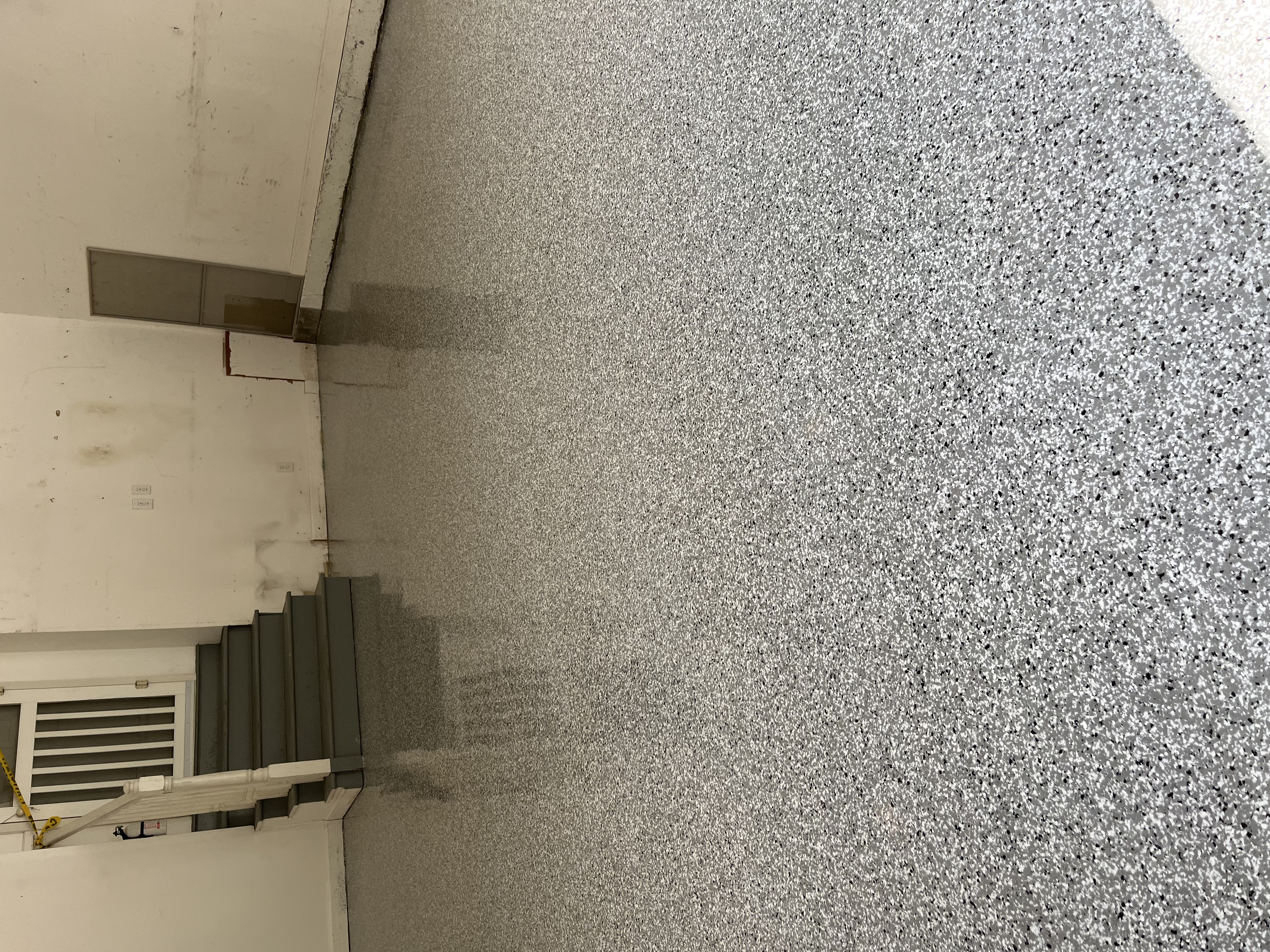Epoxy garage floor white flake residential caution tape curing