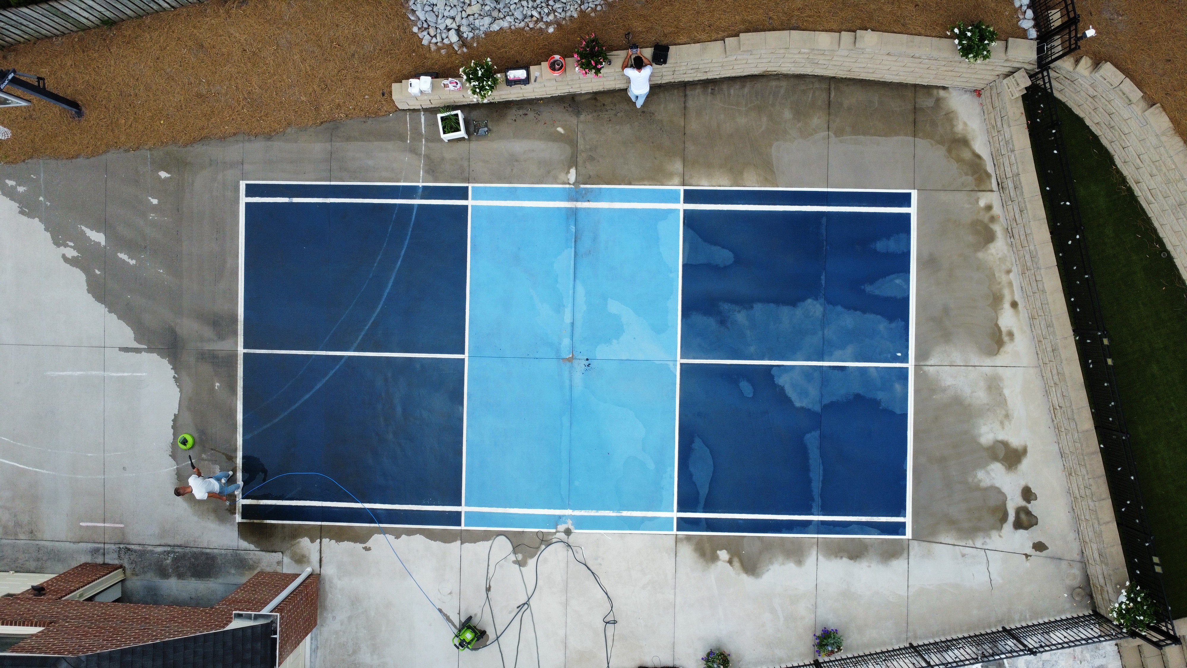 Pickleball court installation in progress aerial coating blue