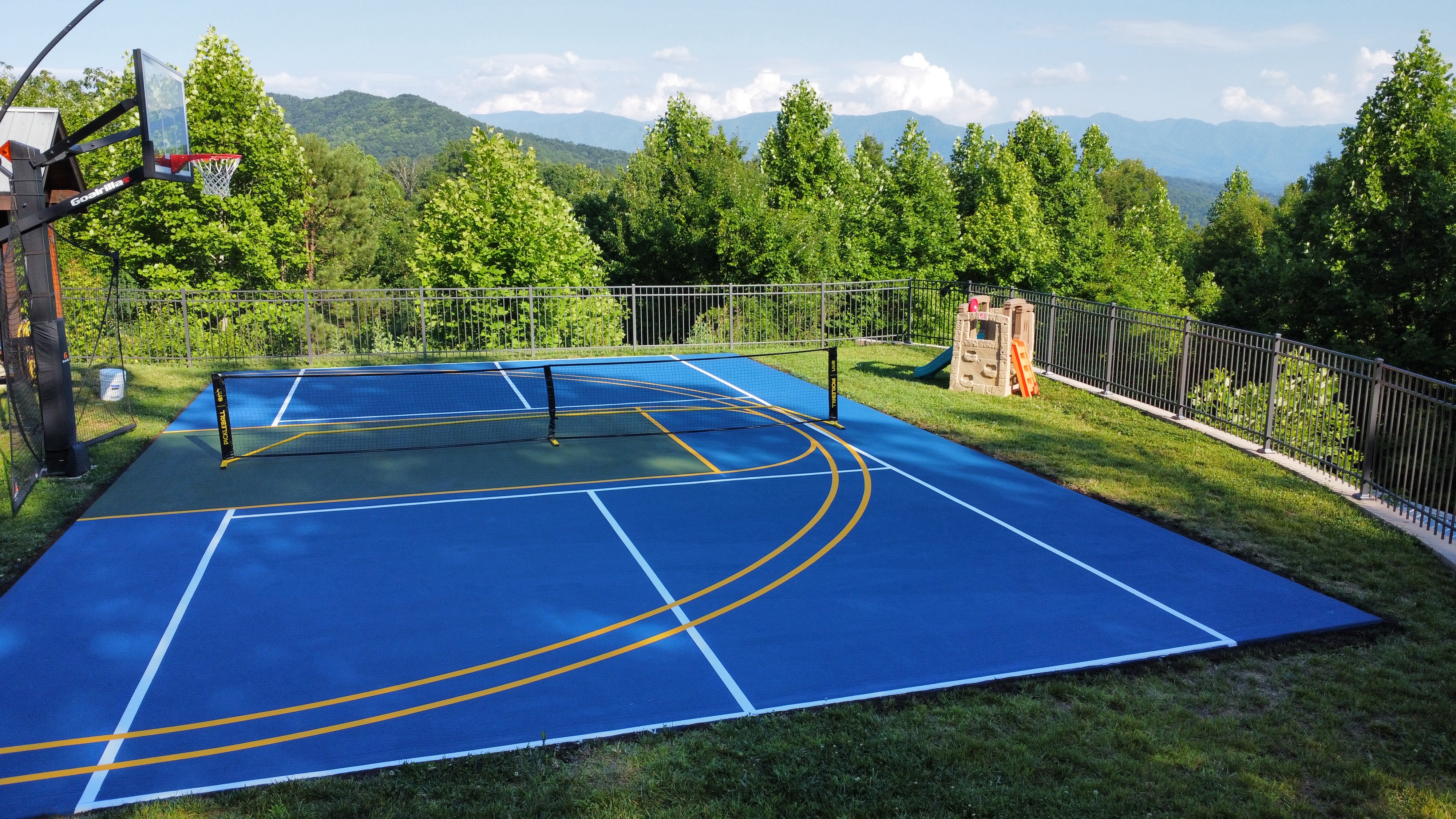Outdoor basketball court residential aerial blue gold