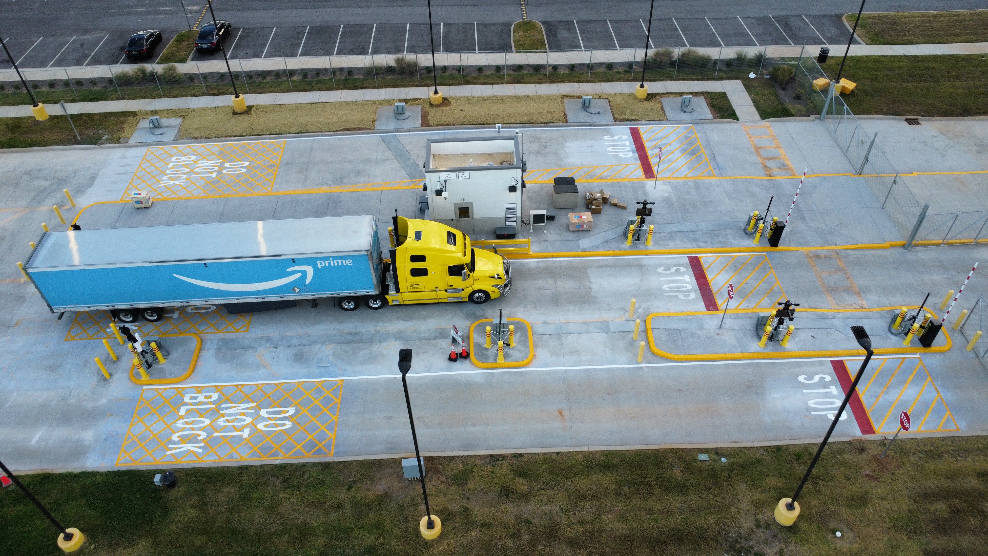 Large commercial asphalt pavement striping yellow lines aerial