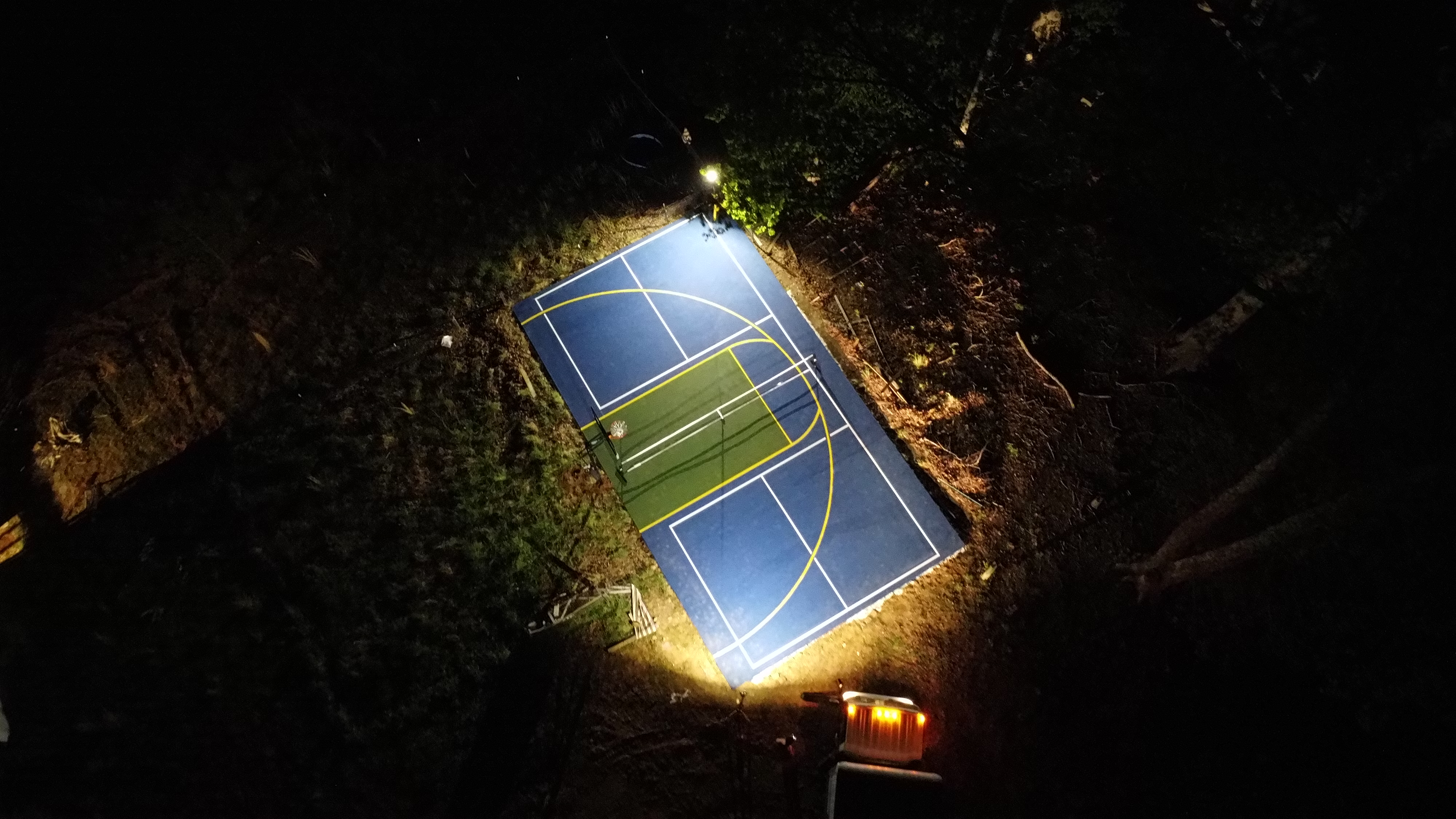 Half basketball court concrete marking residential aerial drone