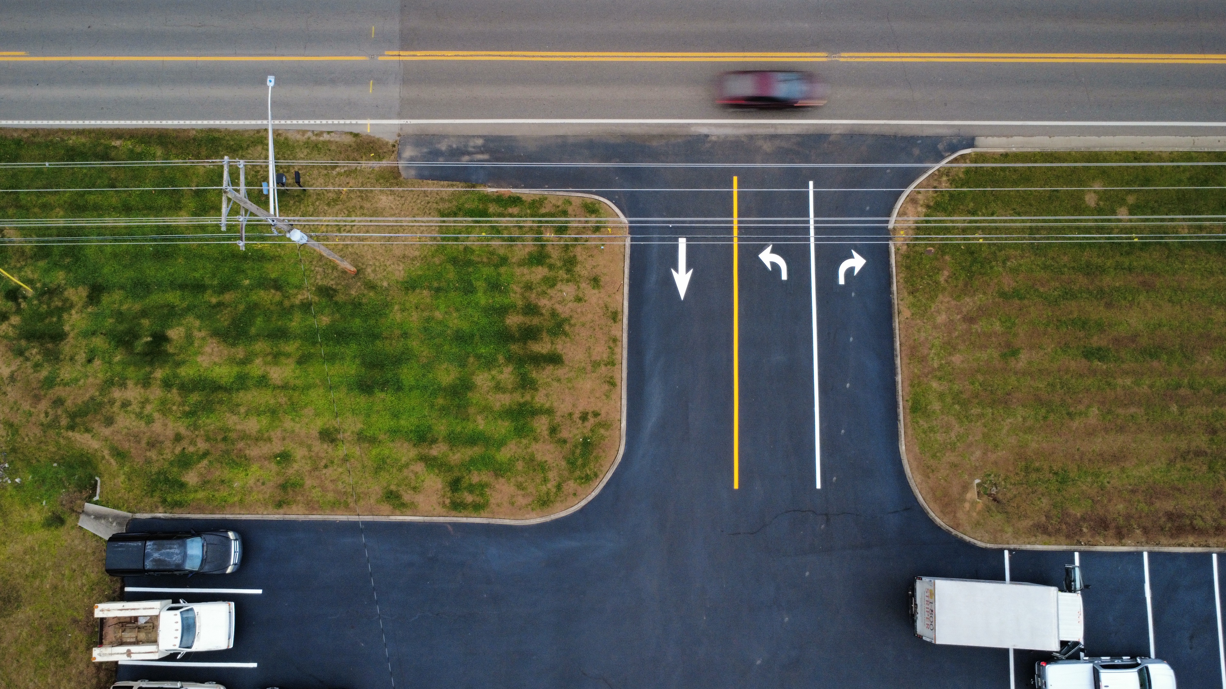 Commercial pavement markings stop bar yellow line aerial southeast