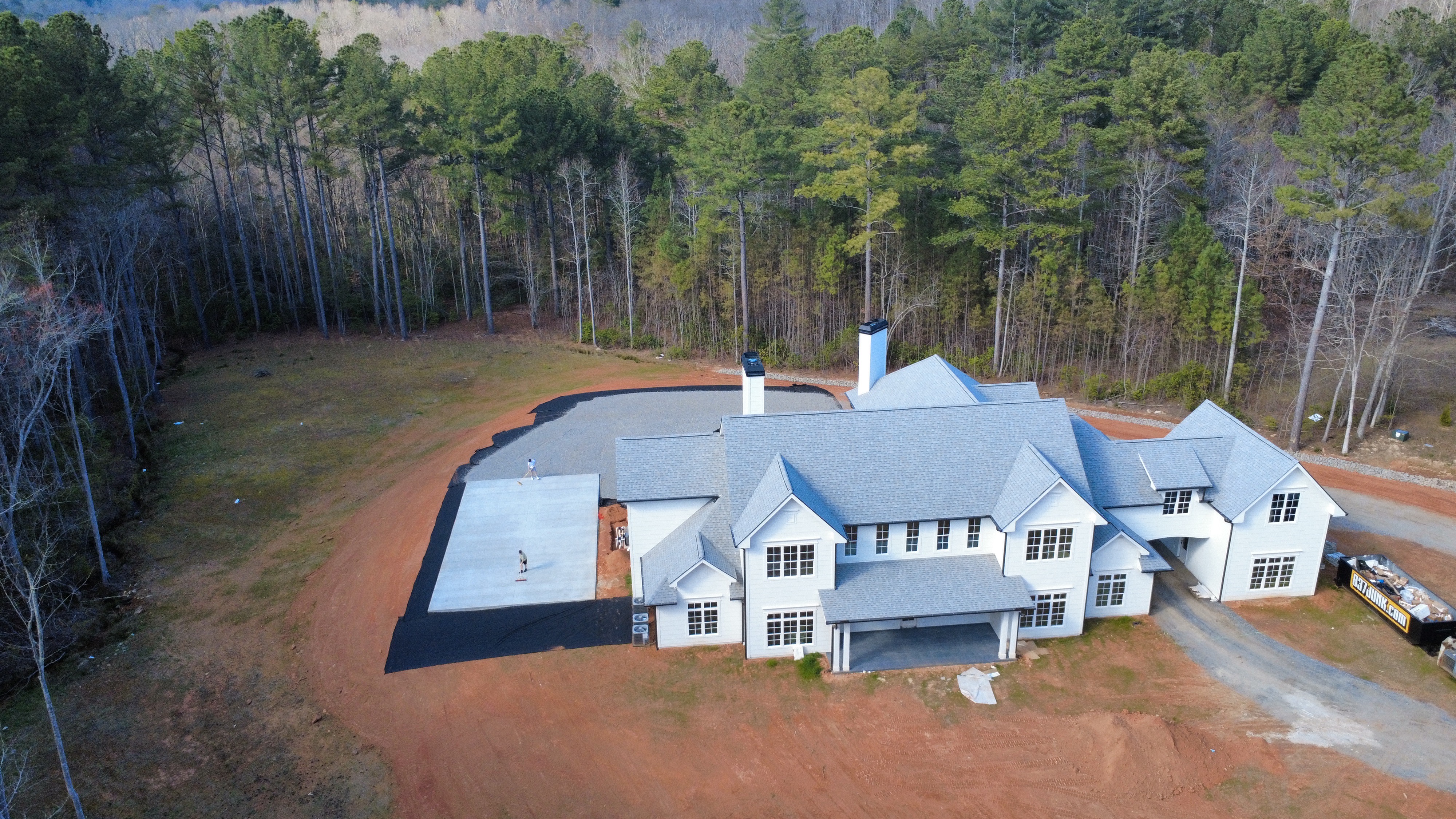 New asphalt residential court installation before coating aerial