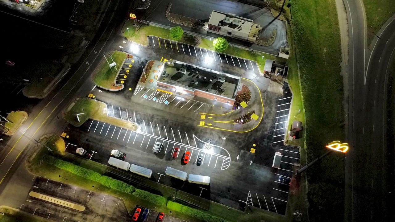 McDonald's parking lot restripe night aerial complete